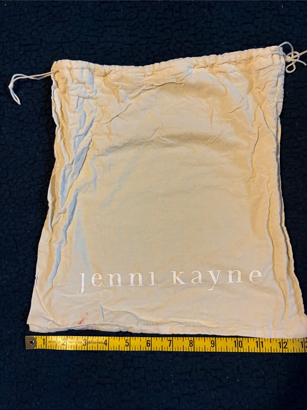 Jenni Kayne cream drawstring dust bag